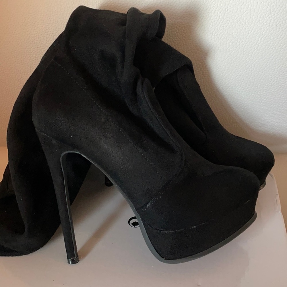 Black over the knee platform  boots.